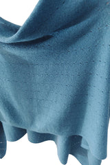 Teal blue cashmere poncho close up