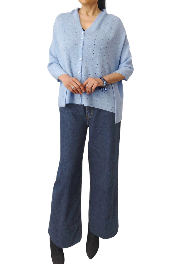 Cashmere poncho light blue, buttons in front
