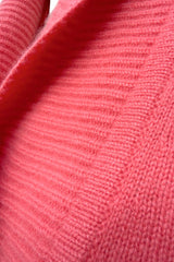 Chunky cashmere cardigan in coral, close up texture